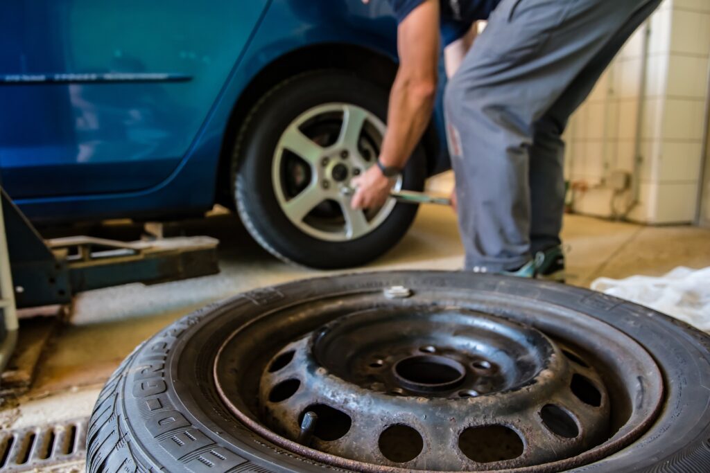 Shows someone putting air in a tyre